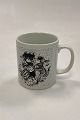 Faience monthly mug for January – KONTAKT. Designed by Bjørn Wiinblad for Nymølle. Shows ...