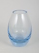 Per Lütken for Holmegaard, vase.Organically shaped vase in clear glass with a pale blue base ...