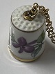 Bing & Grondahl thimble with a purple violet motif and gold edge on a gold-plated ...