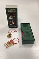 Georg Jensen Golden Christmas Holiday Ornament - Snowman and Sledge 2004Design: Lene Munthe