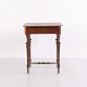 Small antique side table from the 19th century featuring a single front drawer, decorative key ...