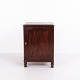 Small antique mahogany cabinet from the 19th century with a simple panelled door, moulded top ...