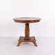 Antique round mahogany pedestal table dating from around the 1840s. The table features a ...