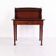 Antique mahogany writing desk from the 19th century featuring a raised gallery, two drawers and ...