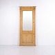 Large antique wall mirror in pine with a strong architectural composition. The frame features ...