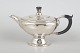 Georg Jensen, rare and early teapot, model 88.Rare and early teapot executed in hand-hammered ...
