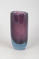 Vicke Lindstrand for Kosta Boda, vase.Sculptural art glass vase in a deep violet colour with a ...