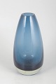 Tamara Aladin for Riihimäen Lasi, vase.Organically shaped vase in blue art glass with a ...