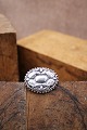 Antique oval silver brooch with floral motif. Measurements: 3.5x3 cm.