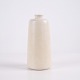 Saxbo vase in stoneware with a light cream-coloured glaze and a simple cylindrical form with ...