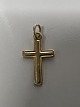 A beautiful, classic gold cross—a powerful religious symbol often worn by Christians and ...