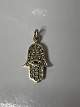 The pendant is a Hamsa piece—also known as the Hand of Fatima—featuring a stylized five-fingered ...