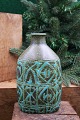 Kgl. oval faience Baca vase designed by Nils Thorsson from Aluminia with green / black pattern. ...