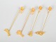 Andreas Mikkelsen for Georg Jensen, set of four Golden Christmas candleholders.Four brass ...