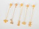 Andreas Mikkelsen for Georg Jensen, set of five Golden Christmas candleholders.Five brass ...