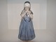 Royal 
Copenhagen 
Figurine, Girl 
in dress from 
Bornholm.
The factory 
mark tells, 
that this was 
...