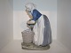 Large Royal 
Copenhagen 
Figurine, Farm 
girl with 
potatoes.
The factory 
mark tells, 
that this ...