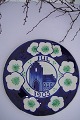 Faience 
Aluminia 
Christmas plate 
from the year 
1905,  with 
motiv of church 
and the 
christmas ...