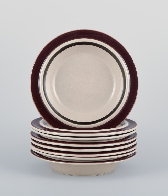 Raija Uosikkinen and Ulla Procopé for Arabia, Finland. A set of eight "Ruija" 
deep plates in stoneware with brown decoration.