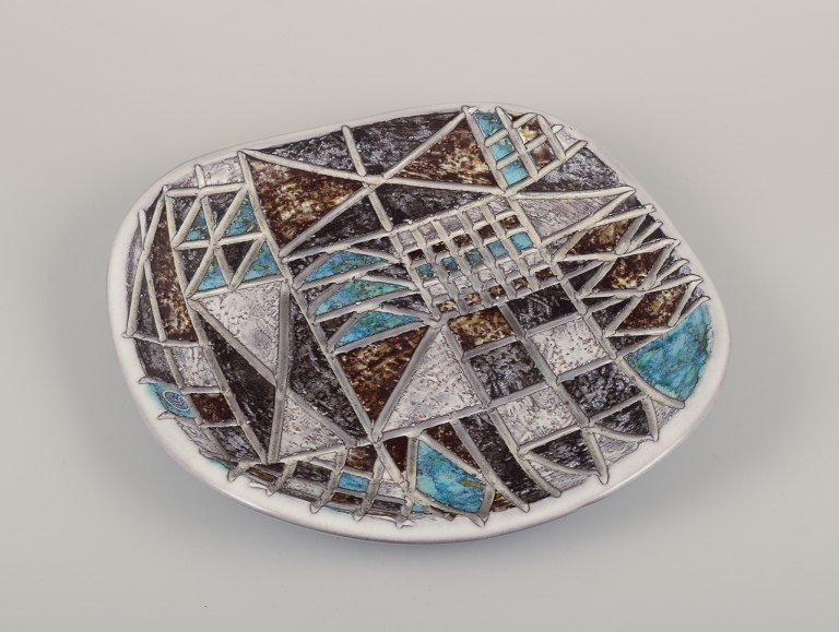 Ingrid Atterberg (1920-2008) for Upsala Ekeby, Sweden. Large "Tri" ceramic dish. 
Geometric pattern with polychrome glaze.