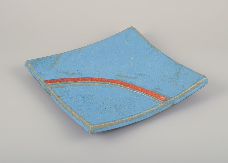 Curt Magnus Addin (1931-2007), Swedish ceramic artist.
Unique square ceramic tray in a modernist style. Made of grog clay with 
turquoise glaze and an orange line.