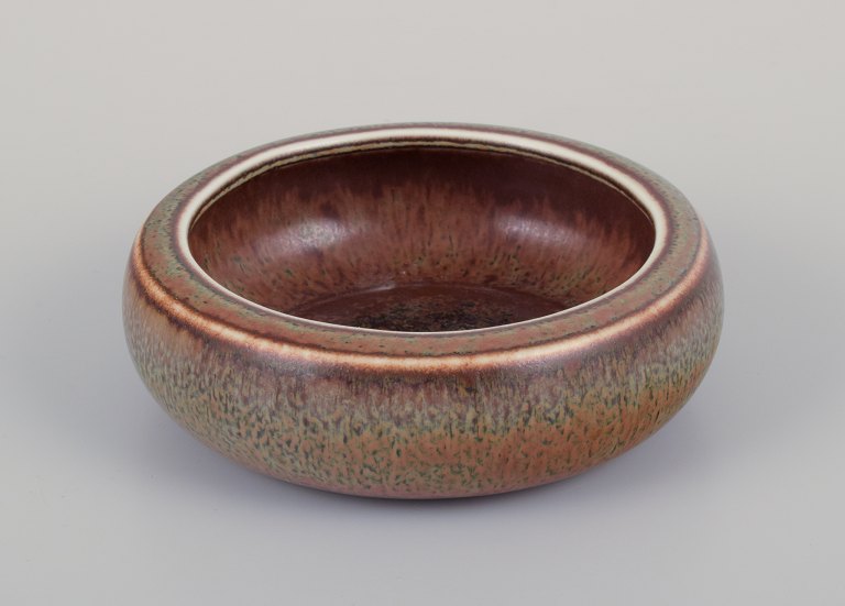 Carl Harry Stålhane (1920-1990) for Rörstrand. Low ceramic bowl with brown and 
green glaze.