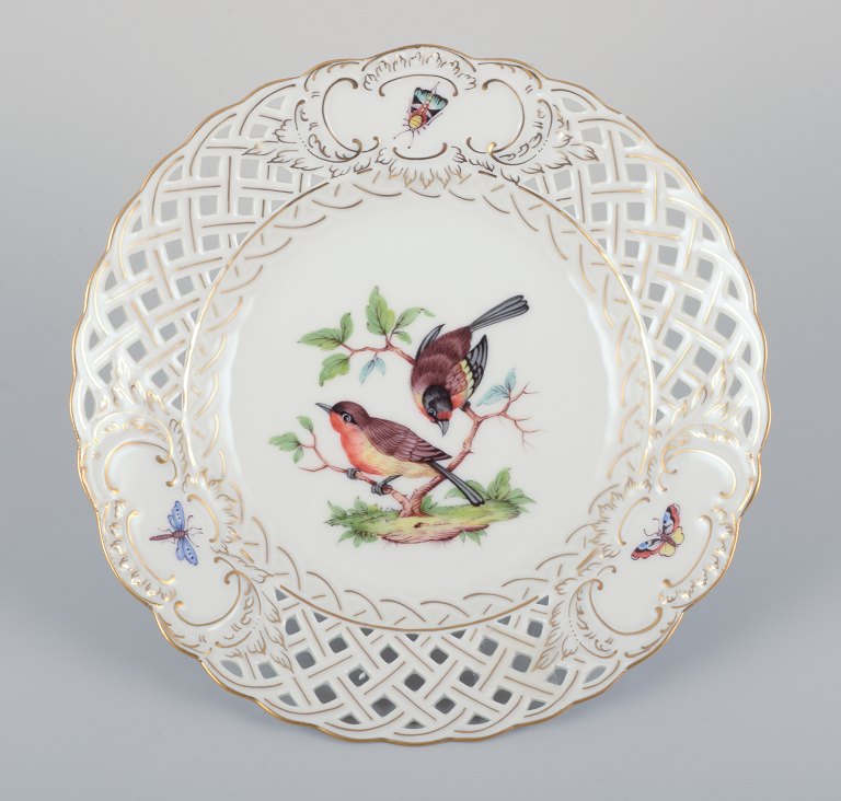 Meissen, Germany. Open lace porcelain plate. Hand-painted with a bird motif and 
insects, gold trim.