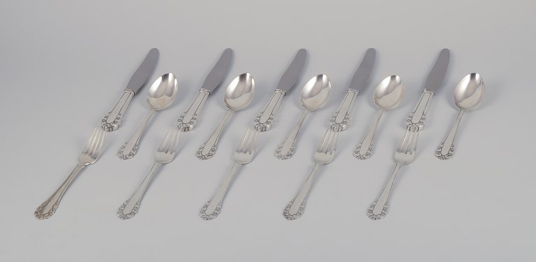 Georg Jensen Lily of the Valley. Complete lunch service consisting of five lunch 
knives, five lunch forks, and five dessert spoons.