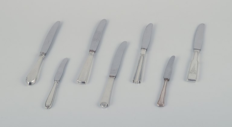 Cohr and other Danish silversmiths. Seven fruit knives in sterling silver with 
stainless steel blades. Art Nouveau and Art Deco styles.