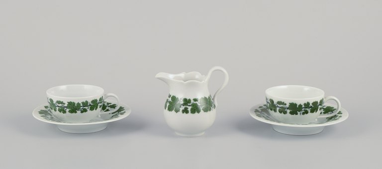 Meissen, Germany, Green Ivy Vine, two coffee cups with matching saucers and a 
creamer.