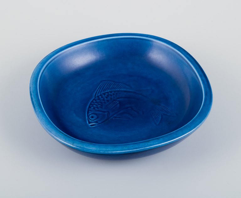 Nils Thorsson for Aluminia. Faience bowl with blue glazed finish. Featuring a 
fish motif.