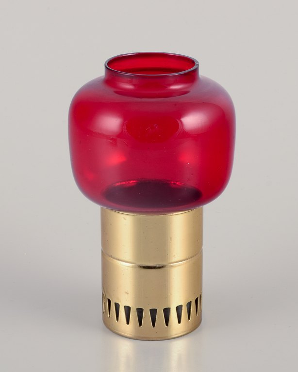 Hans-Agne Jakobsson for A/B Markaryd.
Candlestick holder in brass and red art glass.