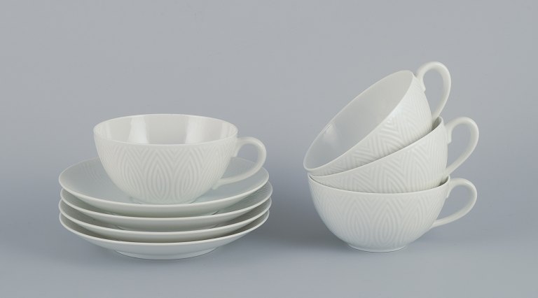 Axel Salto for Royal Copenhagen. Four pairs of teacups in white porcelain.