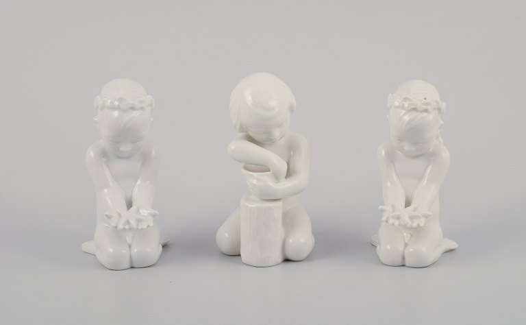 Bing and Grondahl, three porcelain figurines of girls.