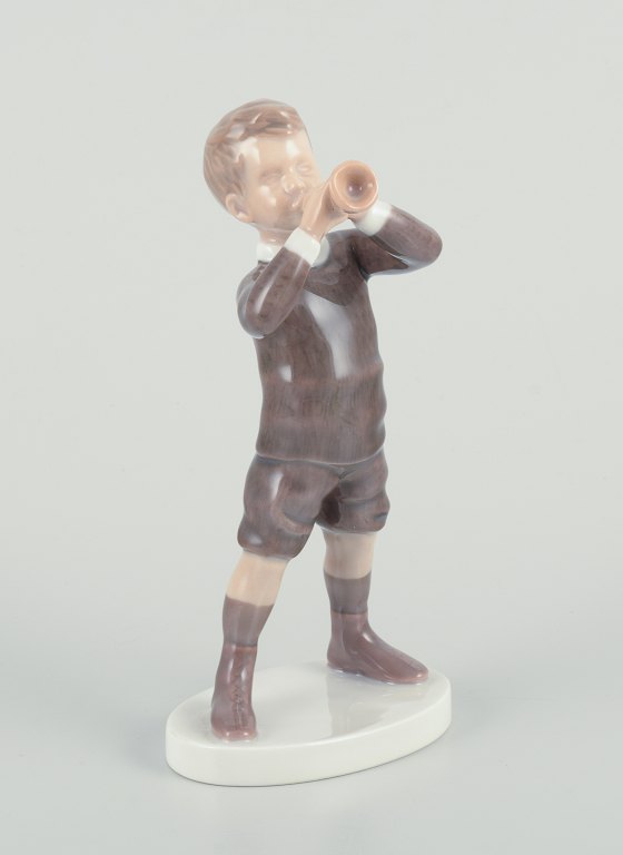 Bing and Grondahl, porcelain figurine of boy with horn.