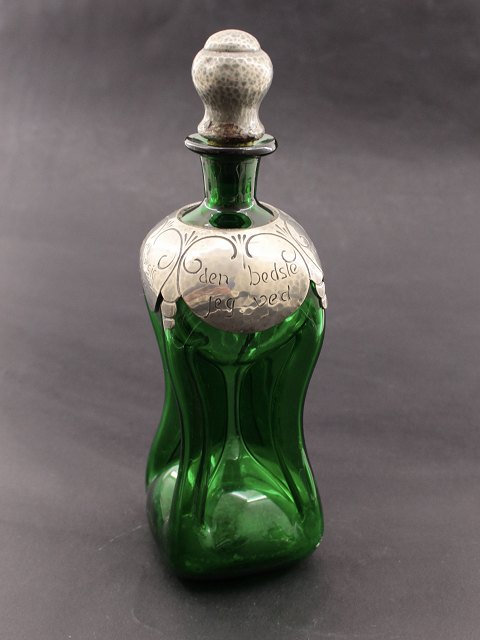 Green decanter with tin mounting