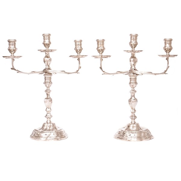 Pair of sterlingsilver Rococostyle candelabra by A. Michelsen, Copenhagen, 1951. 
H: 35,5cm. W: 2.053gr