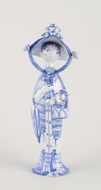 Bjørn Wiinblad. “Autumn” from the series ‘The Four Seasons’, figure in blue 
glazed earthenware.