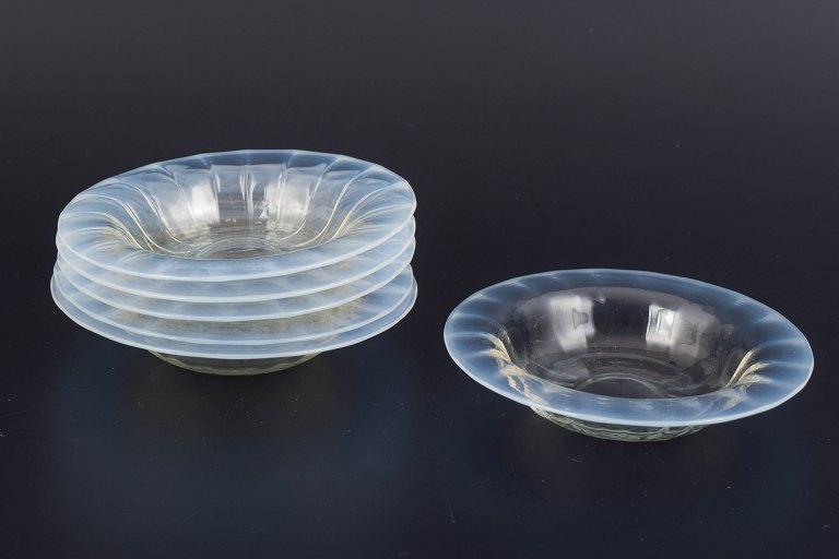 Set of six small art glass bowls.