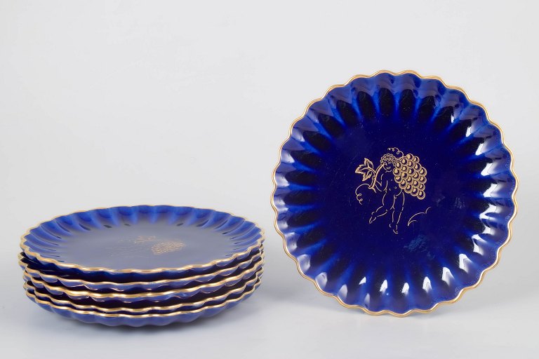 Set of six Gustavsberg plates with gold decor.