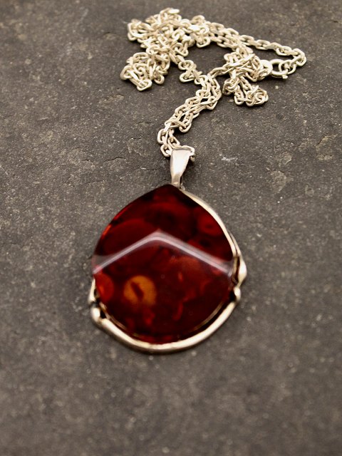 Sterling silver pendant with amber