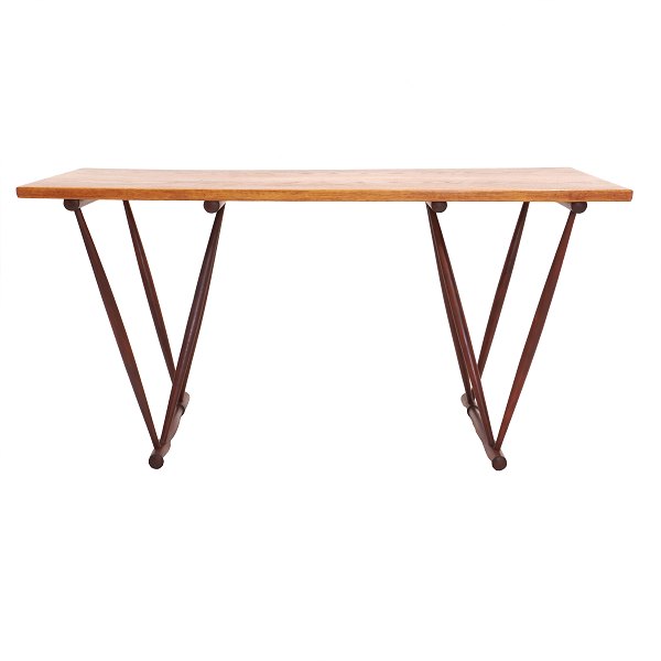 Desk designed by Frode Holm for Illums Bolighus, Copenhagen, 1944. Oak top and stained beech frame. With label and metal plaque from Illums Bolighus. H: 73cm. Top: 74×149cm